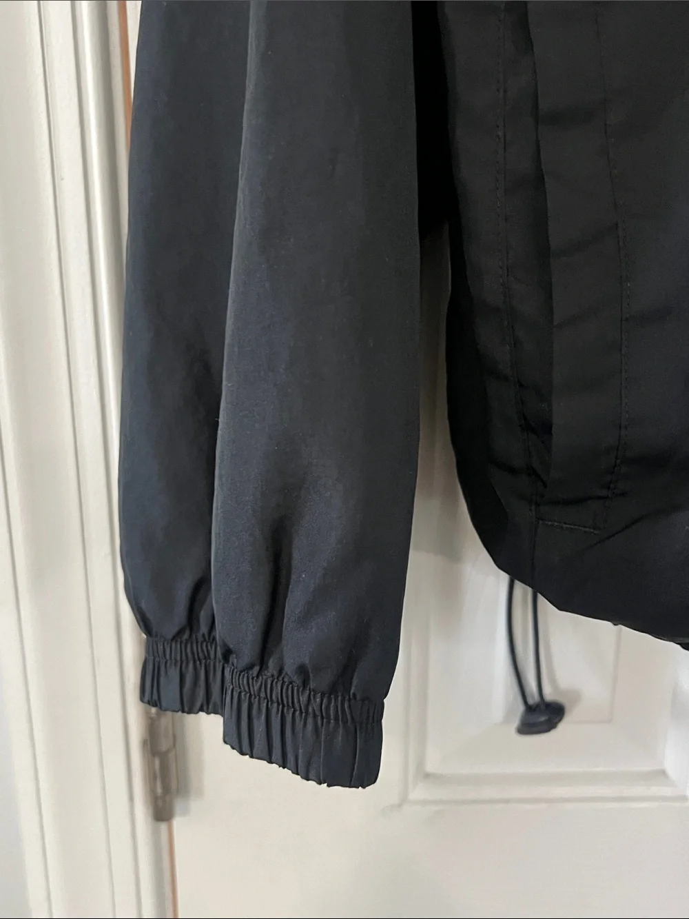 Alphalete Black Windbreaker with White Piping Accents